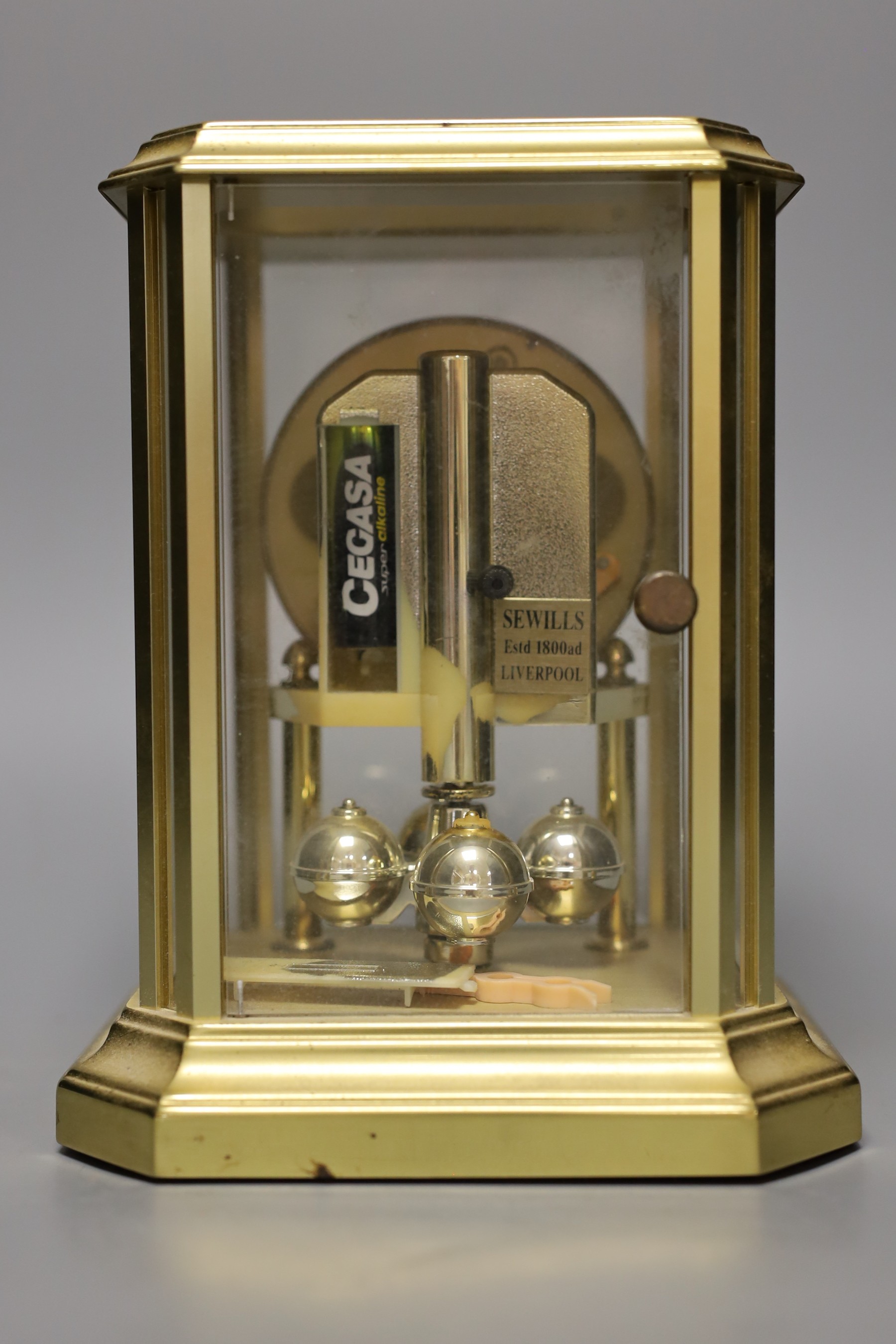 A four glass Sewells 400 day clock, 20cm high.